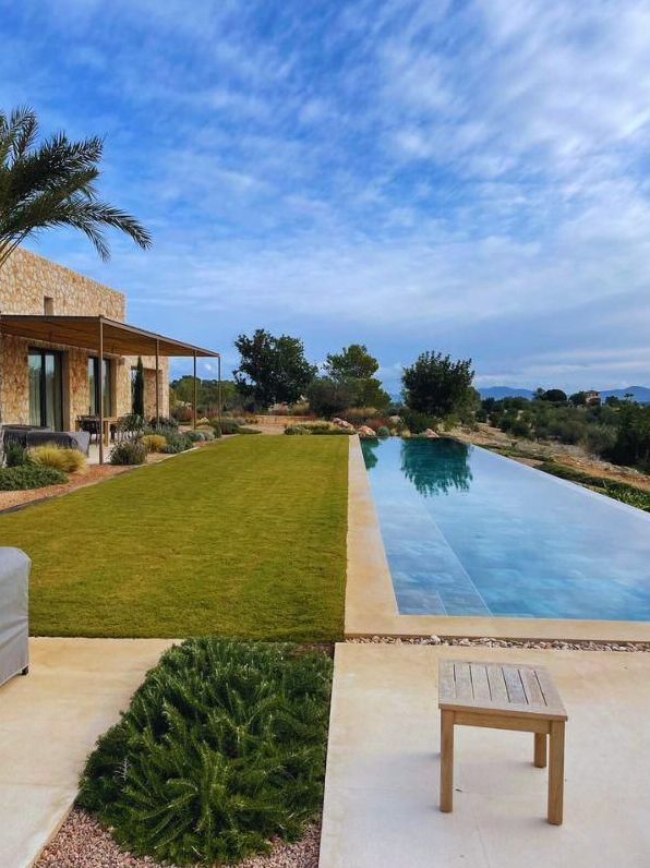 Lawn and infinity pool with views